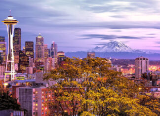Seattle city skyline with Mount Rainier in the background at dusk