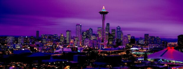 Seattle city skyline with the iconic space needle and illuminated skyscrapers at night