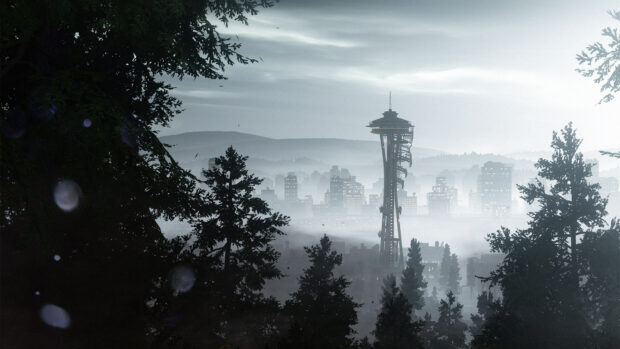 Seattle city skyline with fog and trees surrounding the area at dawn