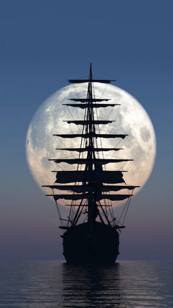 A tall ship silhouette sailing in front of a large full moon at dusk