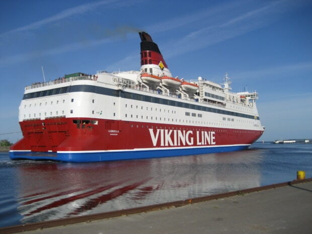A large Viking Line ship sailing on calm water under a clear blue sky