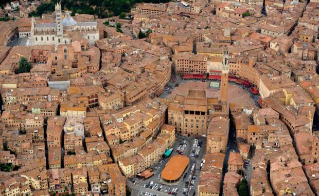 Aerial view of Siena city center with historic buildings and the Torre del Mangia tower
