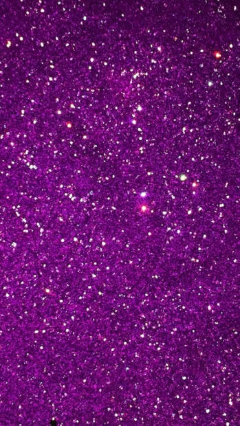Sparkle texture with vibrant purple glitter shining brightly across the surface