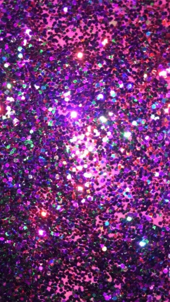 Close up of colorful glitter sparkle in high definition on a vibrant surface