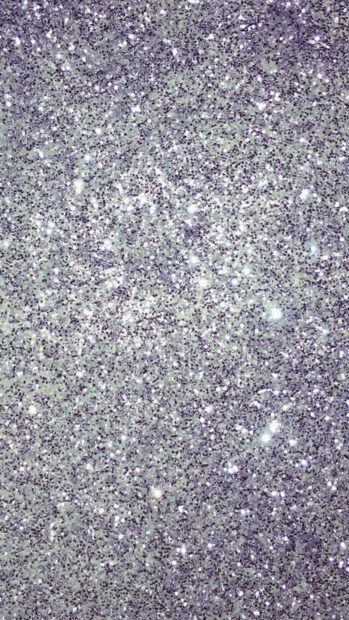 Close up of sparkle texture shining brightly in silver glitter