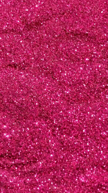 Shimmering pink sparkle surface with fine glitter texture