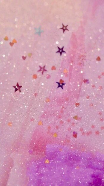 Colorful glitter with heart and star shapes sparkle in a soft pink and purple tone