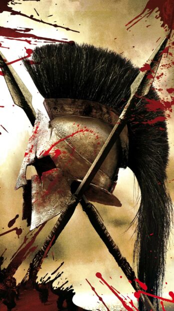 Ancient Spartan helmet with crossed spears and blood splatters on a battle scene