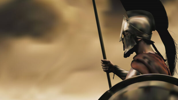 A warrior in ancient armor holding a spear and shield in a Spartan scene