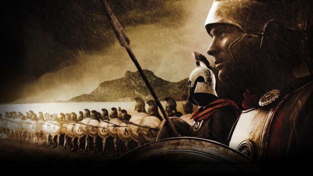 Spartan soldiers lined up with shields and spears in a battle formation under stormy skies