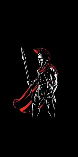 Spartan warrior holding a spear with a red cape standing ready for battle