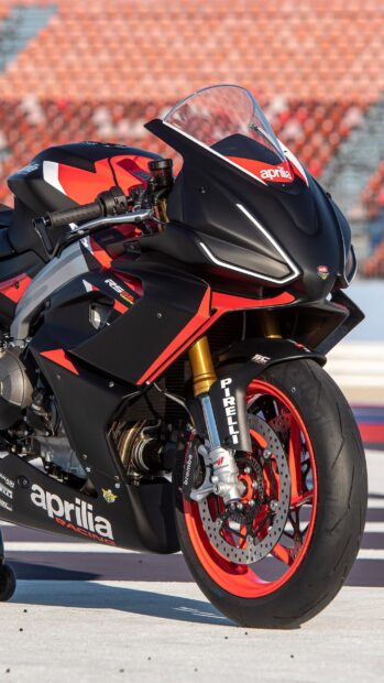 Close up of sports bike racing machine with red and black colors showcasing advanced engineering