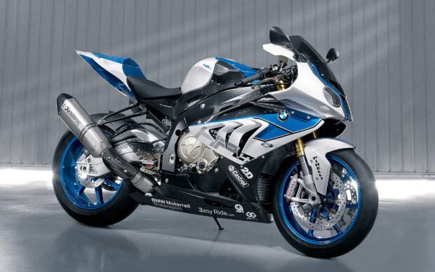 A high quality sports bike with blue and white design standing on a gray surface