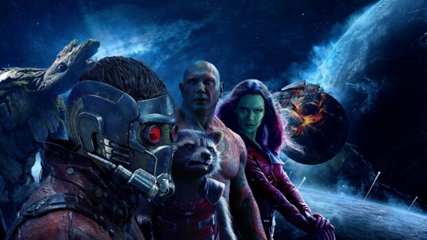 Star Lord and his team standing in space with planets and stars in the background
