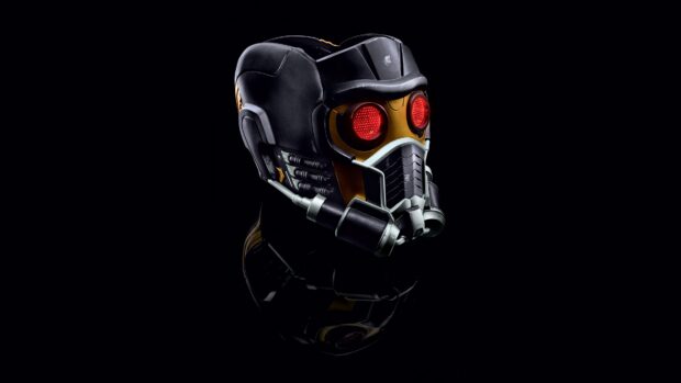 A detailed close up of Star Lord helmet with glowing red eyes in a dark setting