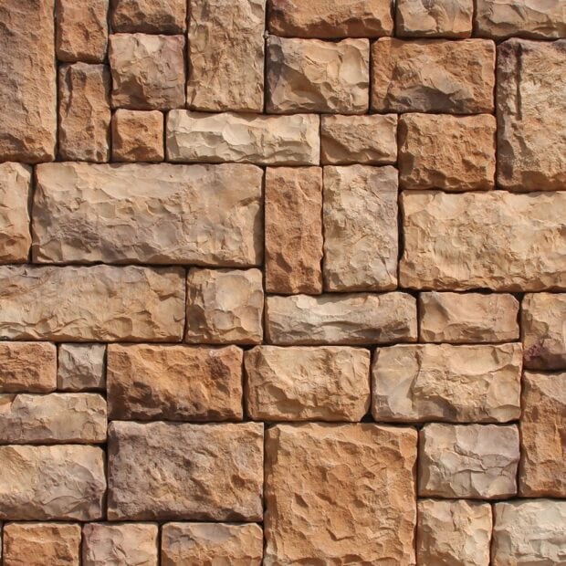Rustic stone wall texture with natural rough surface and varied shapes