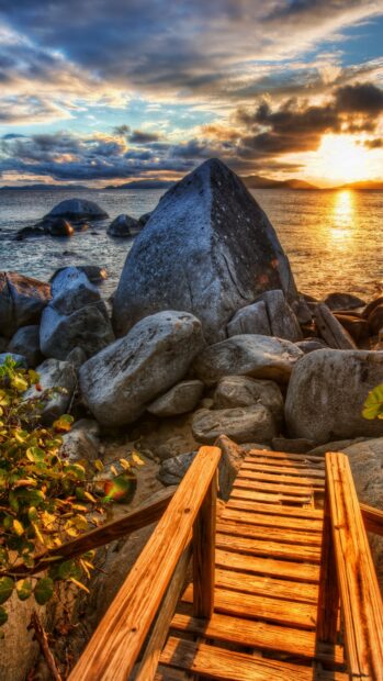 Stone Wallpapers 4K Mobile Wooden stairs leading to large stones near the shore at sunset