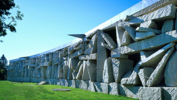 A large stone structure composed of many rough cut stones forming a unique architectural design