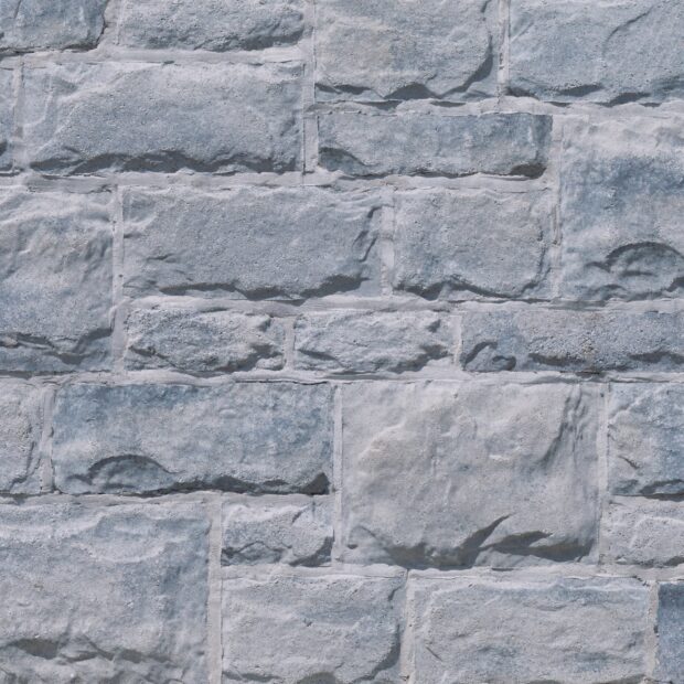 Close up of stone wall texture showing rough surface and pattern