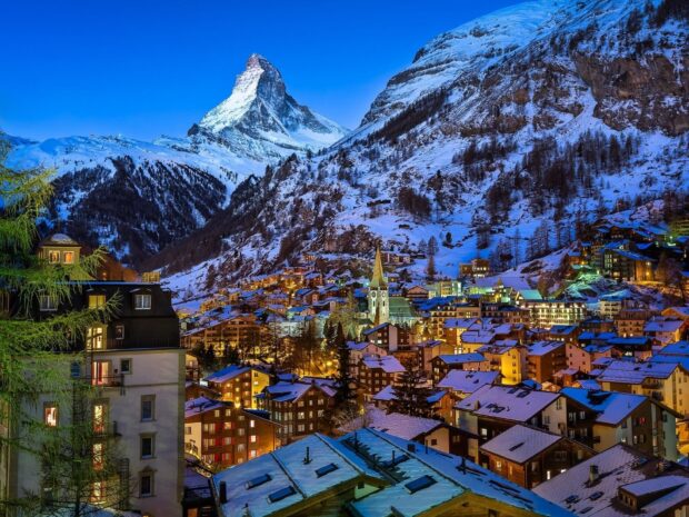 Snowy mountain village in Switzerland with the Matterhorn peak in the background