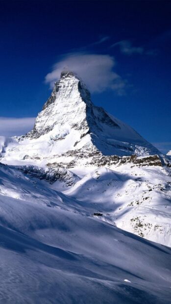 Snow covered Matterhorn peak in Switzerland under clear blue sky