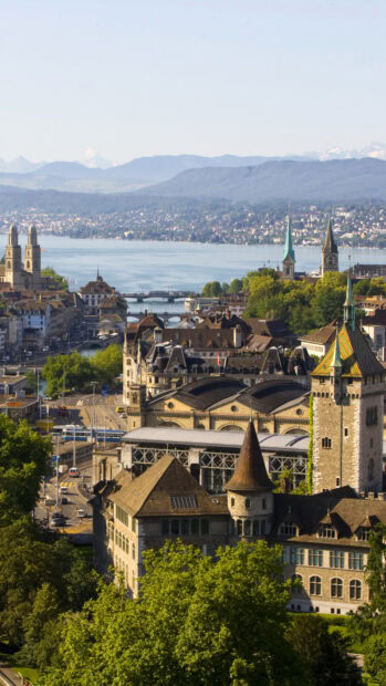 Historic architecture of Zurich against scenic Switzerland landscape