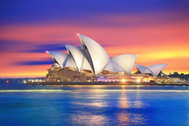 Sydney architecture at sunset with colorful sky and water reflections in Sydney