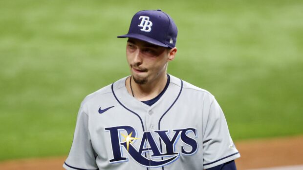 A Tampa Bay Rays player wearing a grey jersey and navy cap on the baseball field