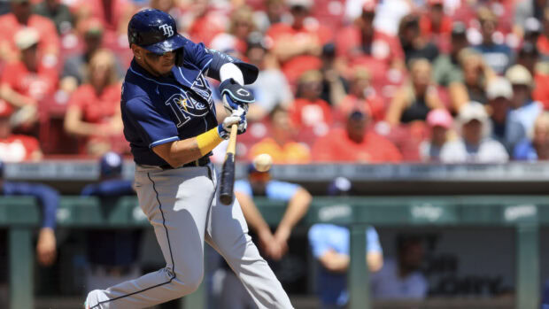 Tampa Bay Rays player hitting the ball during a baseball game at the stadium