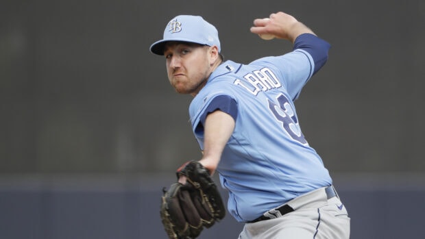 Tampa Bay Rays player pitching during a baseball game on the field