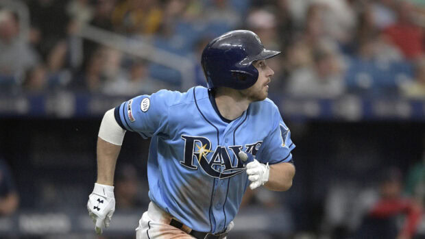 Baseball player wearing Tampa Bay Rays uniform running on field