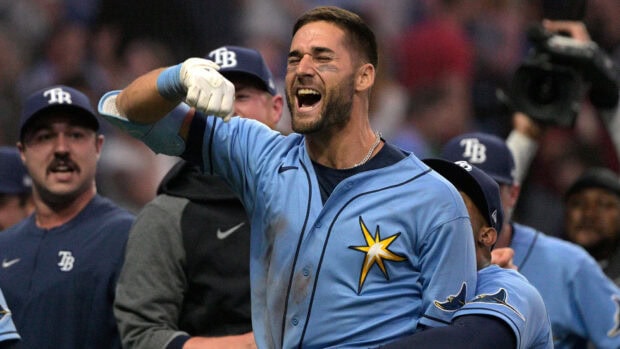 Tampa Bay Rays player celebrating with teammates during a baseball game