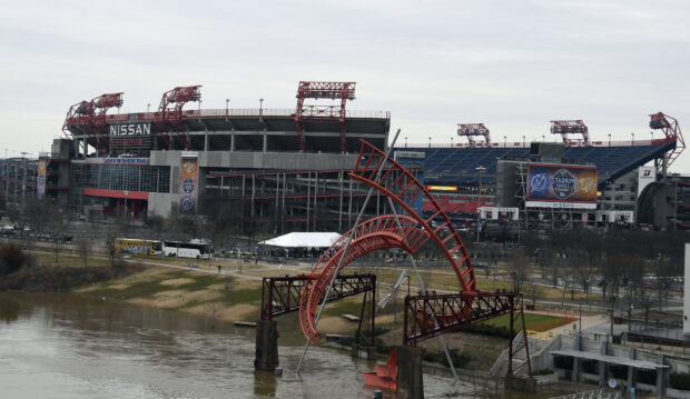 Nashville Tennessee skyline with Nissan Stadium and river sculpture in clear weather
