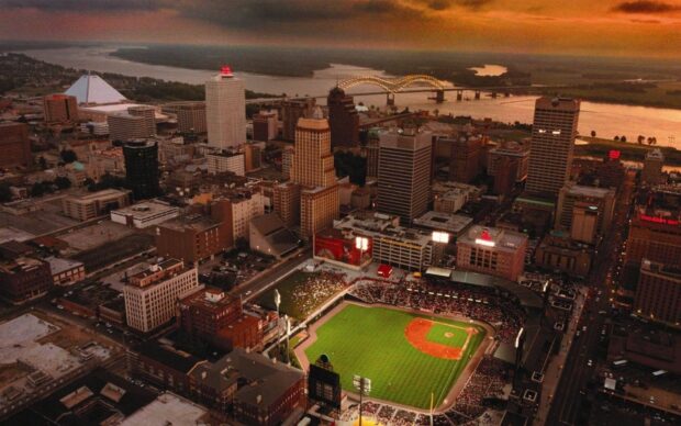 Aerial view of Tennessee cityscape with baseball stadium and river at sunset