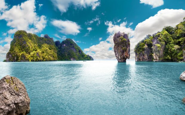 Limestone cliffs and also hills covered with greenery in Thailand sea landscape