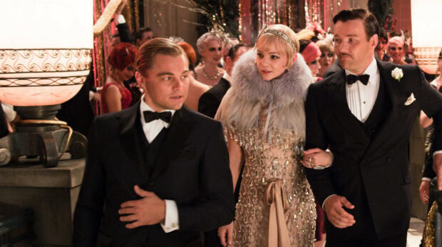 The Great Gatsby characters dressed elegantly at a lavish party