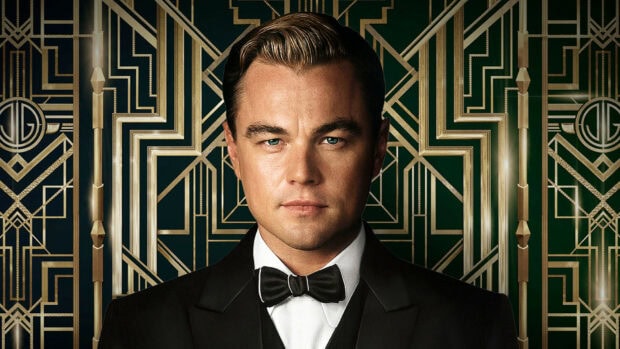 A close up of a man in a tuxedo representing Gatsby character in an art deco setting