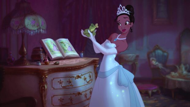 A princess holding a frog in a royal room with an open storybook on a vintage dresser