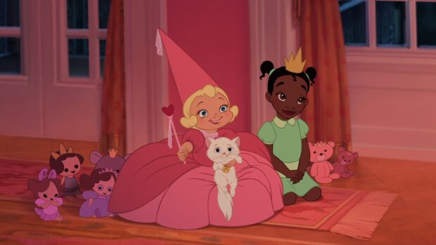 A young girl dressed as a princess with a wand and a cat sitting next to a girl wearing a crown and green dress surrounded by toys