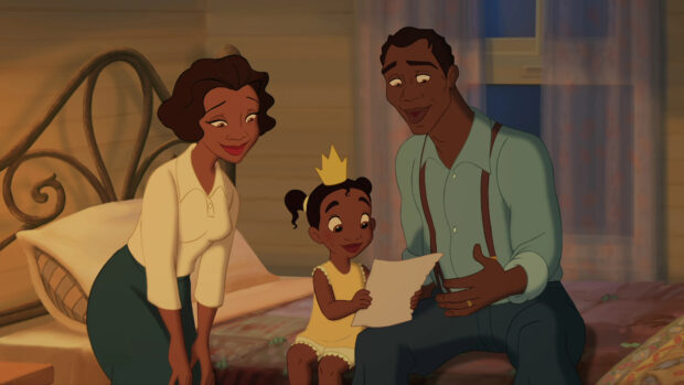 A young girl with her parents happily looking at a drawing in a cozy room