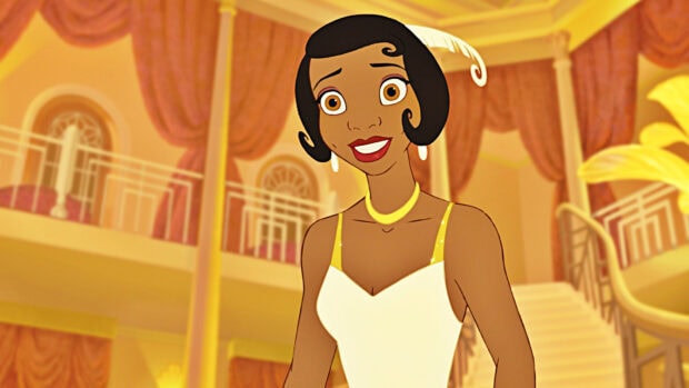A smiling princess in a white dress and elegant hairstyle at a lavish ballroom setting