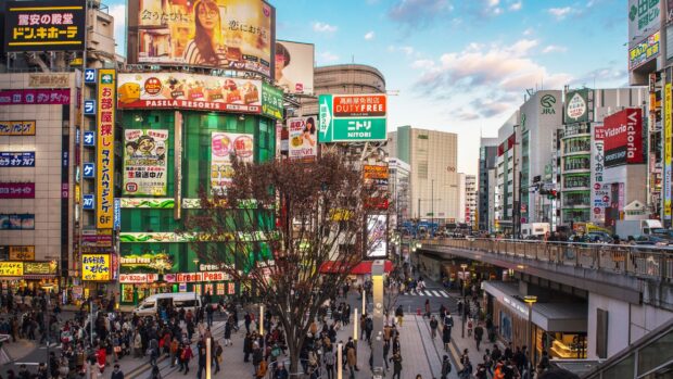 Busy street scene in Tokyo Japan with crowds and colorful billboards