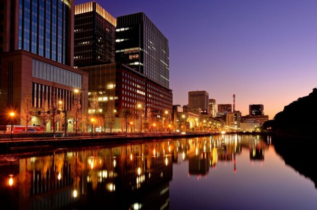 Tokyo cityscape reflecting on the water at dusk in Japan