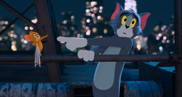 Tom and Jerry characters pointing at each other on a rooftop at night in Tom and Jerry