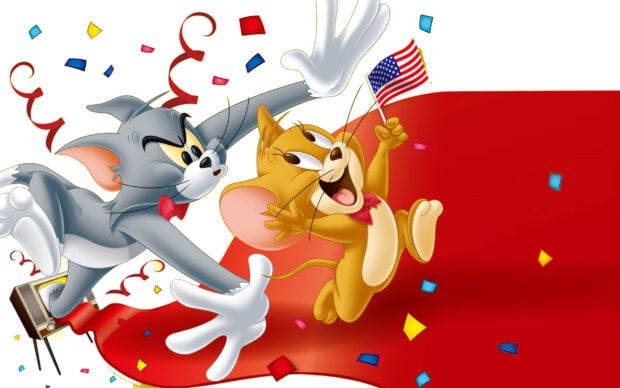Tom and Jerry characters celebrating with an American flag and colorful confetti around them