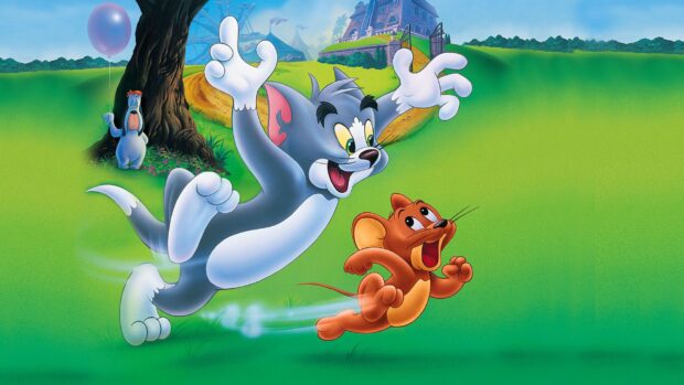 Tom and Jerry chasing each other playfully on a green field with a dog holding a balloon nearby
