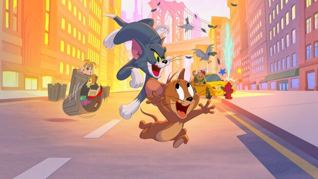 Tom and Jerry chasing each other on a city street with a dog in a trash can and a taxi in the background