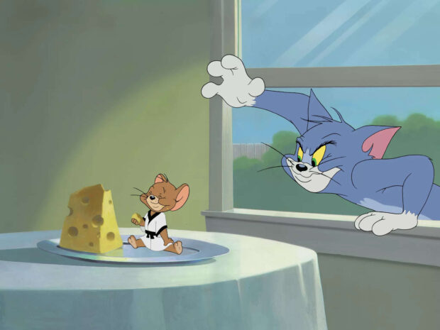 Tom and Jerry character in karate outfit with cheese and cat reaching through window