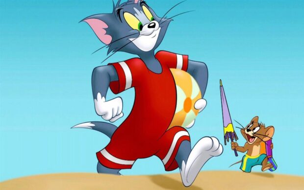 Tom and Jerry enjoying a beach day with Tom in a red outfit holding a ball and Jerry holding a colorful umbrella
