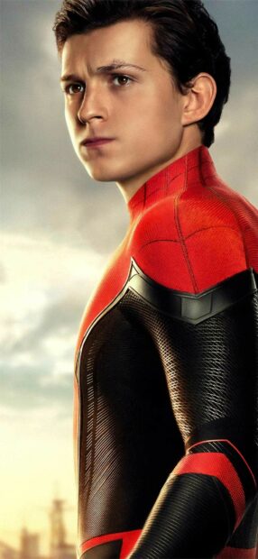 Tom Holland wearing Spider Man suit looking serious in a close up portrait